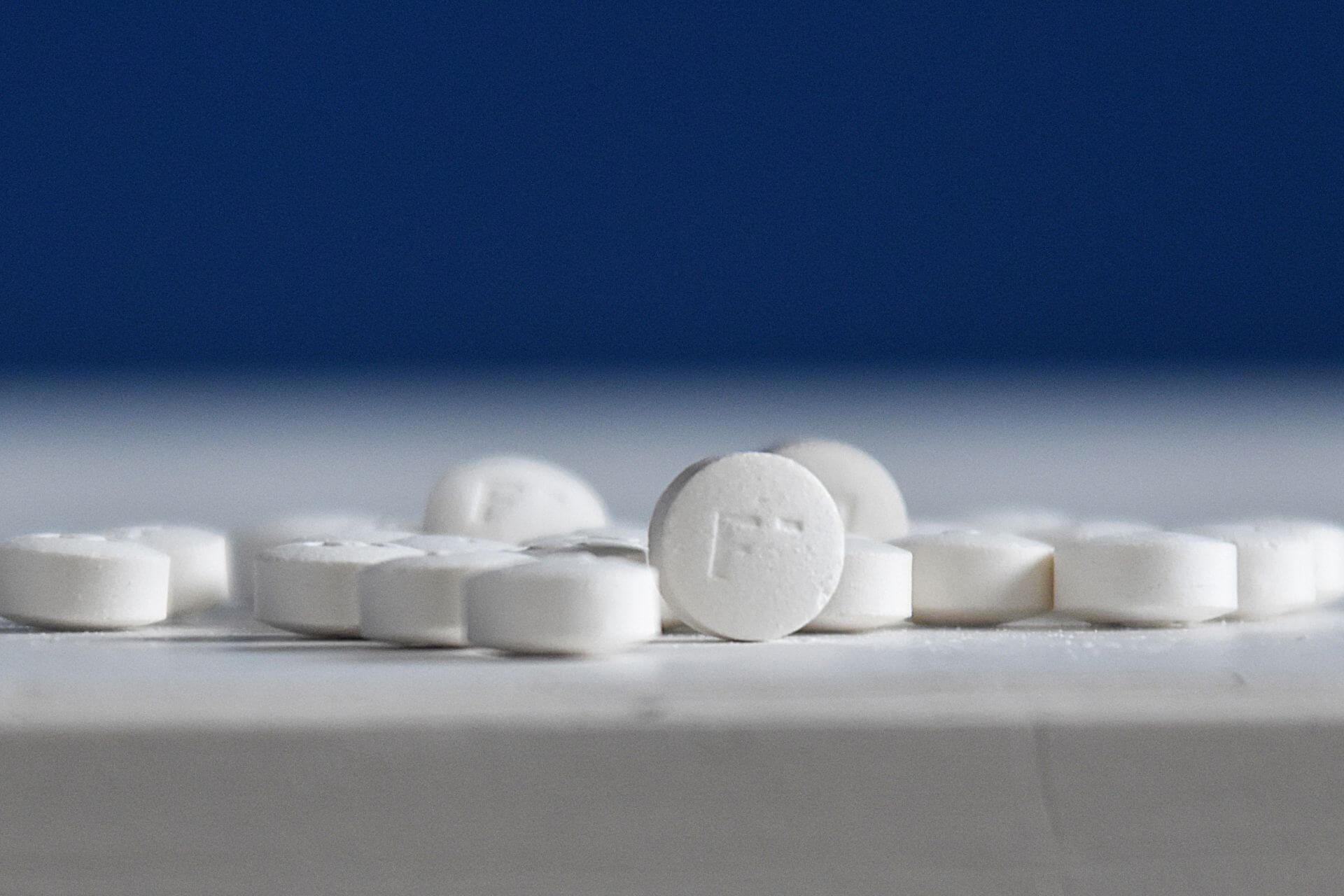 Round Toothtabs toothpaste tablets with fresh mint leaves